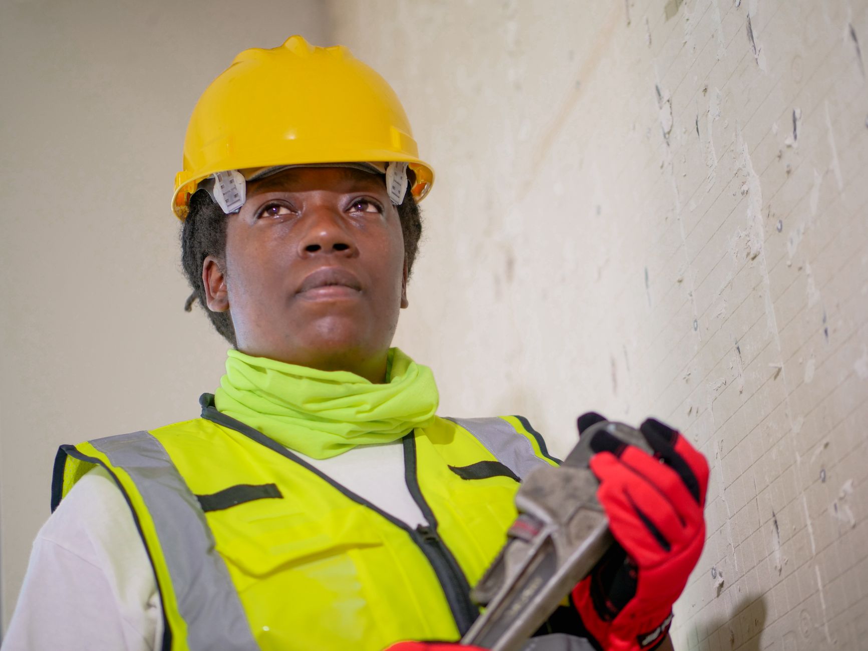Professional plumber with tools ready for service